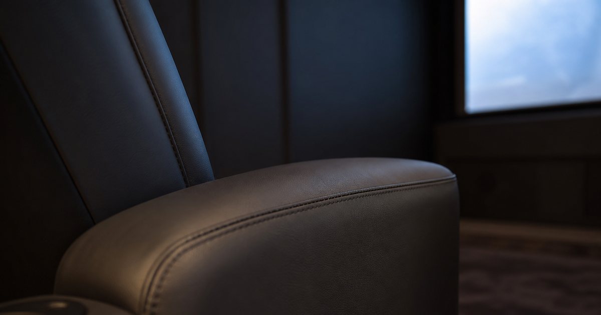 Which upholstery colors reduce screen reflections in a luxury home cinema room?